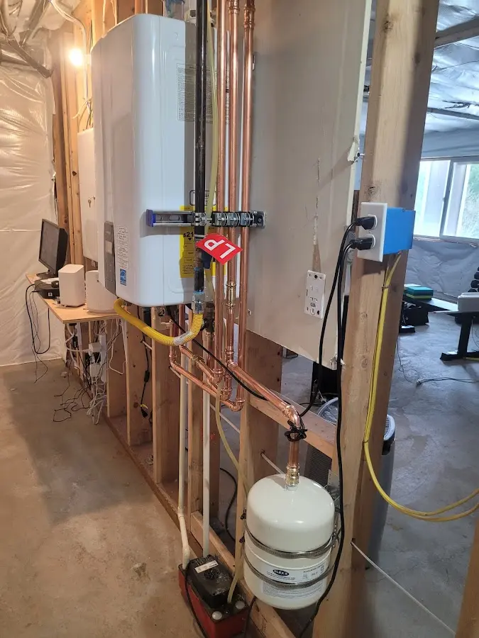 Licensed plumber repairing a kitchen sink in Marcellus